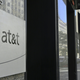 An AT&T telecommunication logo is seen at the entrance of a building in Washington, DC June 11, 2019.